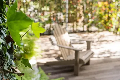 a wooden bench sitting on a wooden deck at GuestReady - Breyner Stonewall Haven in Porto