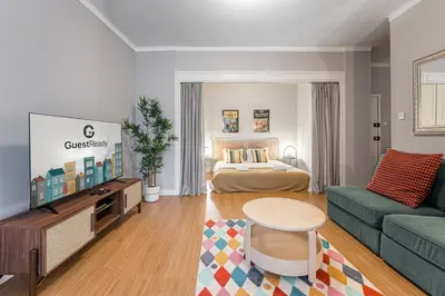 a living room with a bed and a couch at GuestReady - A warm city refuge in Cedofeita in Porto