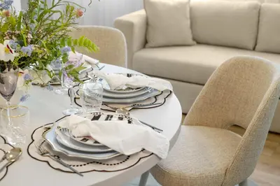 a white dining room table with chairs and a white table cloth at Sittium in Porto