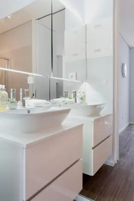 a white bathroom with two sinks and a mirror at Urban Views - ML Apart Inspired by Palácio de Cristal in Porto