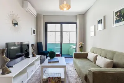 a living room with a couch and a tv at Urban Views - ML inspired by Torre dos Clérigos in Porto