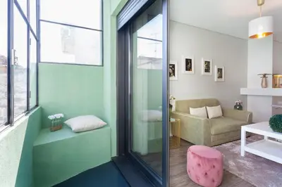 a living room with a couch and a chair at Urban Views - ML inspired by Torre dos Clérigos in Porto