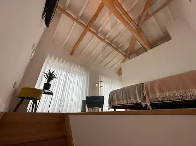 a bedroom with a bed and a desk and a window at Urban Views - ML Apart Inspired in Serralves in Porto