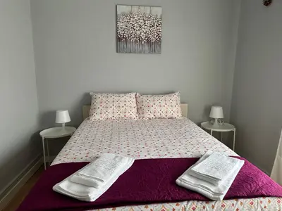 a bedroom with a bed with two towels on it at Vicky Porto in Porto