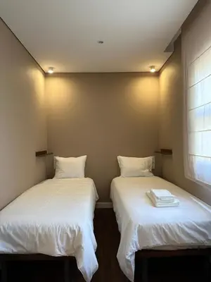 two beds sitting next to each other in a room at House Real Companhia in Vila Nova de Gaia