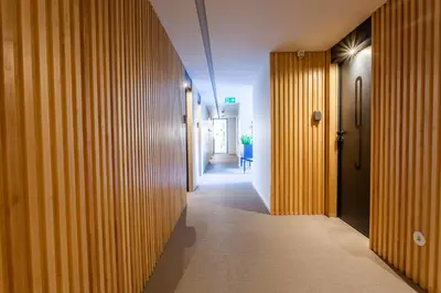 a hotel room with a bed and a desk at Oporto City View - Guest House Suites in Porto