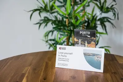 a ticket sitting on top of a table with a plant at GuestReady - Portrait with a view in Porto