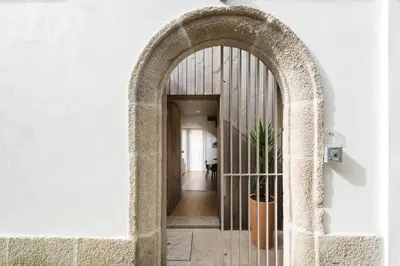 an archway leading to a hallway in a building at AgapeStay Family House in Porto