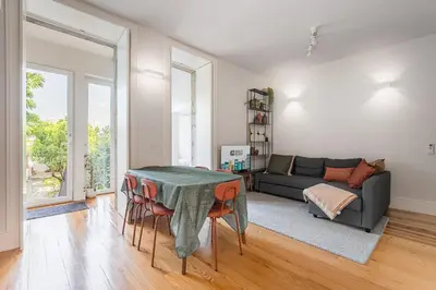 a living room with a table and a couch at GuestReady - The perfect haven near St. Catarina in Porto