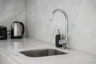 a kitchen sink with a faucet on a counter at GuestReady - The perfect haven near St. Catarina in Porto