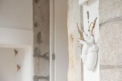 a white object is hanging on a wall at GuestReady - The perfect haven near St. Catarina in Porto