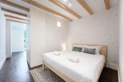 a bedroom with a large white bed in a room at GuestReady - The perfect haven near St. Catarina in Porto