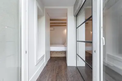 a hallway with a bed in a small room at GuestReady - The perfect haven near St. Catarina in Porto