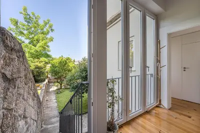 an open door to a balcony with a view at GuestReady - The perfect haven near St. Catarina in Porto