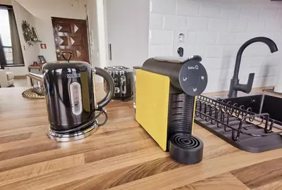 a kitchen with a coffee maker on a counter at Ninho 424 in Porto