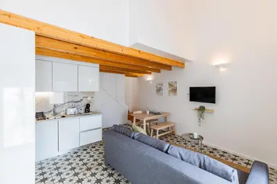 a living room with a couch and a table at A Window to Porto - Pestana charming flat in Porto