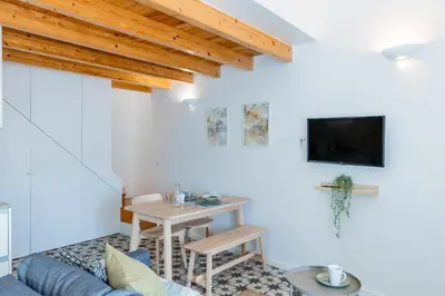 a living room with a couch and a table at A Window to Porto - Pestana charming flat in Porto