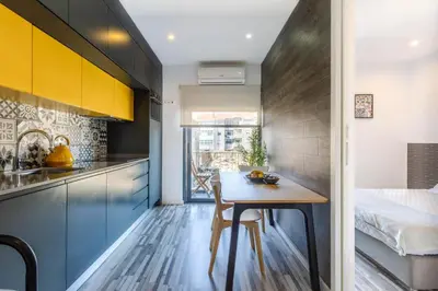 a kitchen and dining room with a table and a bed at Host Wise - Amadeo Apartments in Vila Nova de Gaia