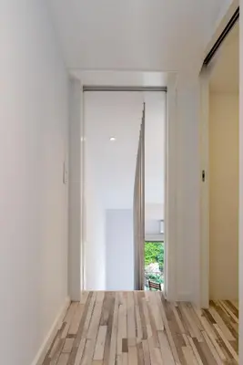 an open door to a room with white walls and wooden floors at Host Wise - Amadeo Apartments in Vila Nova de Gaia