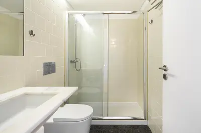 a bathroom with a shower and a toilet and a tub at WHome Central 1-Bed w/ Top View perfect to Explore Porto in Porto