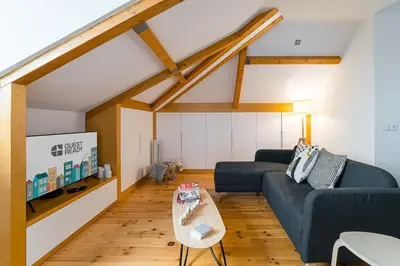 a living room with a couch and a table at GuestReady - Freixo Paradise view in Porto