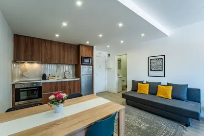 a living room with a couch and a table at Plano C 2 Oporto Downtown in Porto