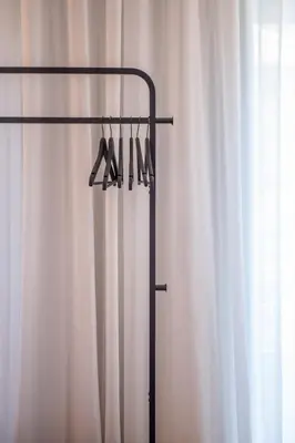 a curtain with a hanger in front at Alliança Suites 1909 - Porto in Porto