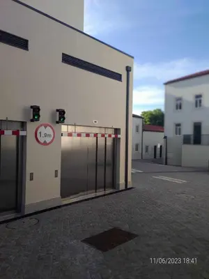 a large white building with a gate with a no entry sign at 24 Porto Novíssímo Estudio em Cedofeita AC Olive in Porto