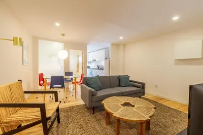 a living room with a couch and a table at Dasi House in Porto