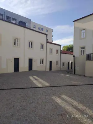 a group of buildings in a parking lot at 25 Porto Novíssímo Estudio em Cedofeita AC Olive in Porto