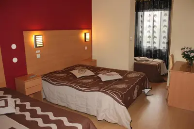 a bedroom with a large bed in a room at Guest House Estrela in Porto