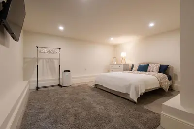 a white bedroom with a bed and a window at Porto Grandeur Collection - D. João IV Pool & Garden Apartment in Porto