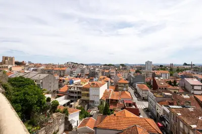 a view of a city with red roofs at Porto Grandeur Collection - D. João IV Pool & Garden Apartment in Porto