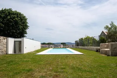 a swimming pool in the backyard of a house at Porto Grandeur Collection - D. João IV Pool & Garden Apartment in Porto