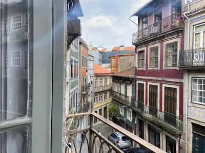 a view of a city street from a window at Babel in Porto