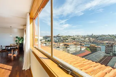 a room with a large window with a view of the city at Hey Apartments A in Porto