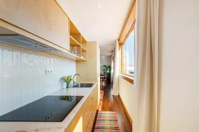 a kitchen with a sink and a window at Hey Apartments A in Porto