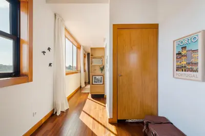 a hallway with a wooden door in a room at Hey Apartments A in Porto