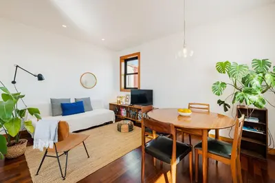 a living room with a table and a couch at Hey Apartments A in Porto