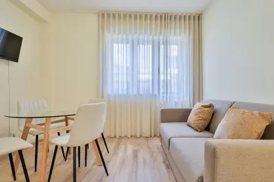 a living room with a couch and a table at Antero sweet & cozy apartment by PCH in Porto