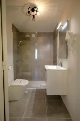 a bathroom with a tub and a sink and a toilet at Antero sweet & cozy apartment by PCH in Porto