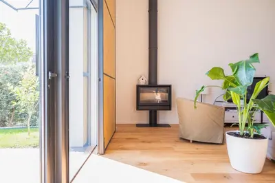 a living room with a television and a plant at Loft in Porto in Porto