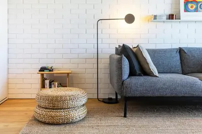 a living room with a couch and a table at S1405 - practical and modern - AC, balcony and parking in Porto