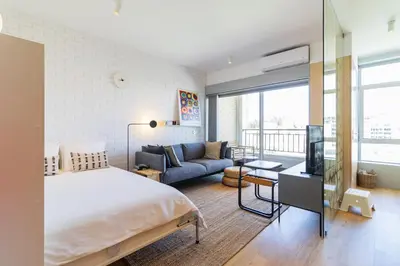 a bedroom with a bed and a couch at S1405 - practical and modern - AC, balcony and parking in Porto