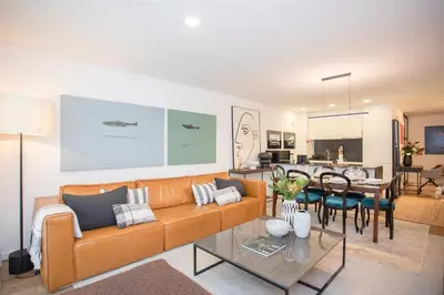 a living room with a couch and a table at Liiiving in Gaia - Cooper Residence Apartment II in Vila Nova de Gaia