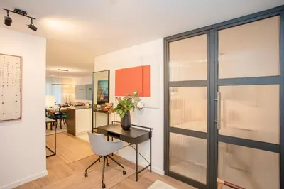 a living room with a desk and a table with a chair at Liiiving in Gaia - Cooper Residence Apartment II in Vila Nova de Gaia