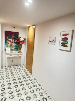 a white bathroom with a toilet and a shower at luxury stay Romantic Douro River & Sunset views in Porto