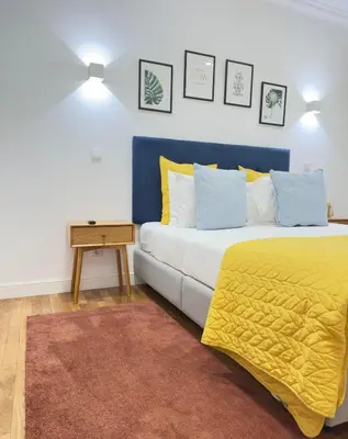 a living room with a couch and a table at Luxury stay Premium Douro River & Sunset views in Porto