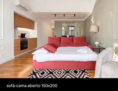 a bedroom with a large bed with red pillows at Luxury stay Premium Douro River & Sunset views in Porto