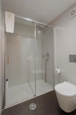 a bathroom with a shower and a toilet at Luxury stay Premium Douro River & Sunset views in Porto